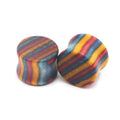 Pair of wood saddle-fit ear plugs with a colorful inlay pattern