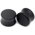 Pair of solid black wood saddle-fit ear plugs