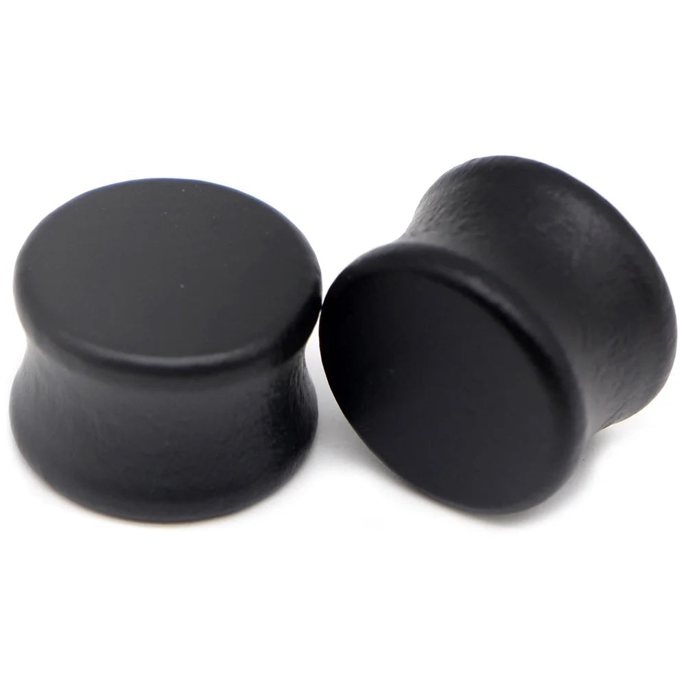 Pair of solid black wood saddle-fit ear plugs
