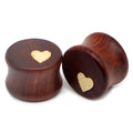 Pair of wood saddle-fit ear plugs with a light heart inlay