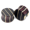 Pair of wood saddle-fit ear plugs with a colorful inlay pattern