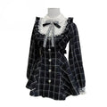 Plaid dress with lace trim and a bow detail