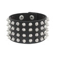 Black PU leather cuff packed with four rows of silver cone spikes on a wide band.