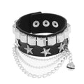 Black PU leather cuff with a row of silver pyramid studs and a row of silver stars, finished with draped silver chains and a small bell charm.
