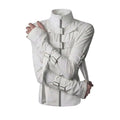 A white buckle strap asylum jacket with tall collar, metal buckle straps across the chest and crossed arms, shown against a black background.