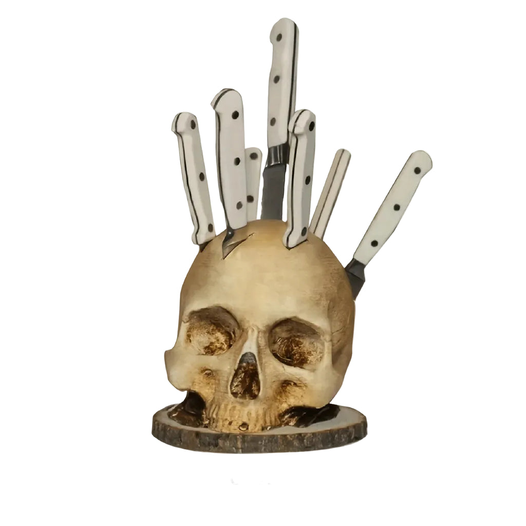 A skull-shaped knife block cast in resin with an aged, bone-toned finish.
