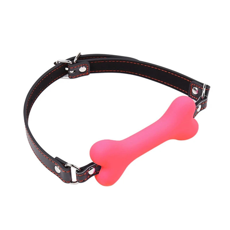Pink silicone bone-shaped gag on an adjustable black PU leather strap with red stitching and a metal buckle.