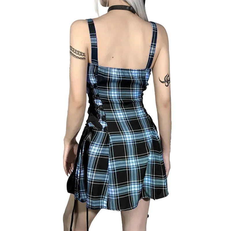 Person wearing a blue and black plaid dress.