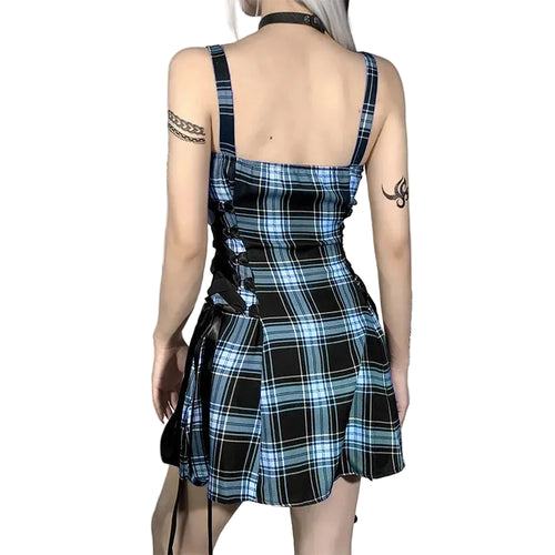 Person wearing a blue and black plaid dress.