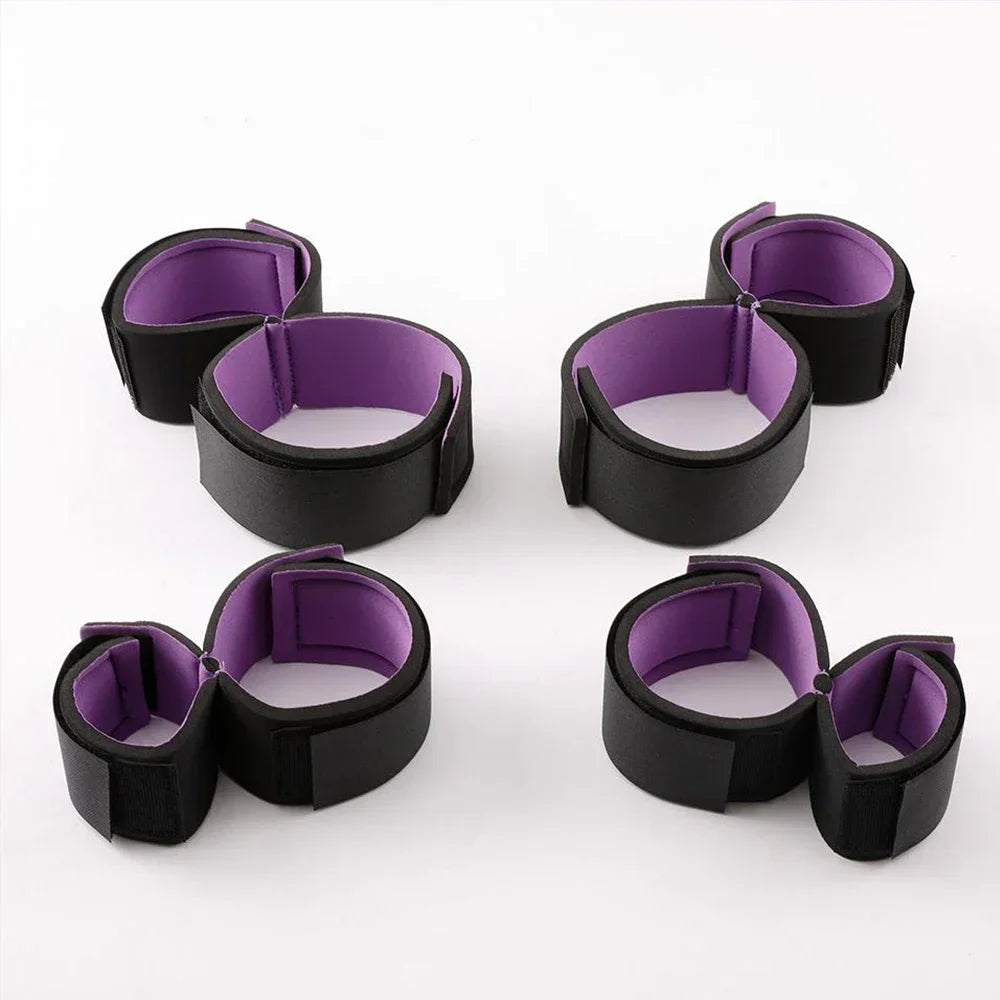 Padded adjustable restraint cuffs in black and purple.