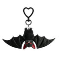 A soft black plush bat with spread wings, red inner ears, and small red bead eyes.