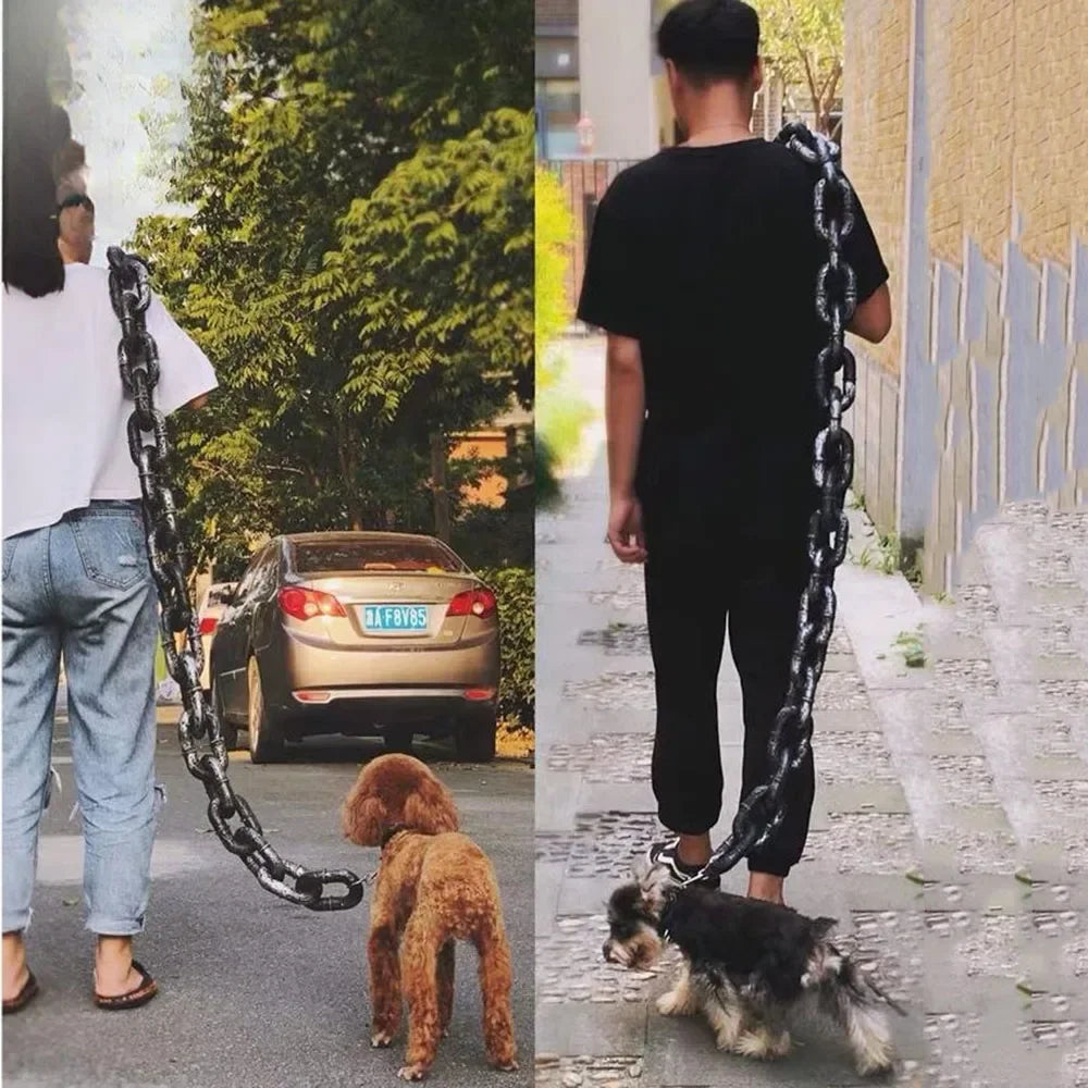 Oversized black plastic chain link pet leash, worn over the shoulder while walking a dog.