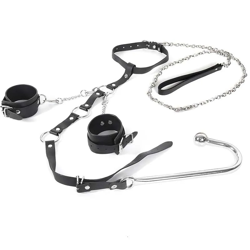 Black collar and wrist cuffs connected by chains to a metal anal hook