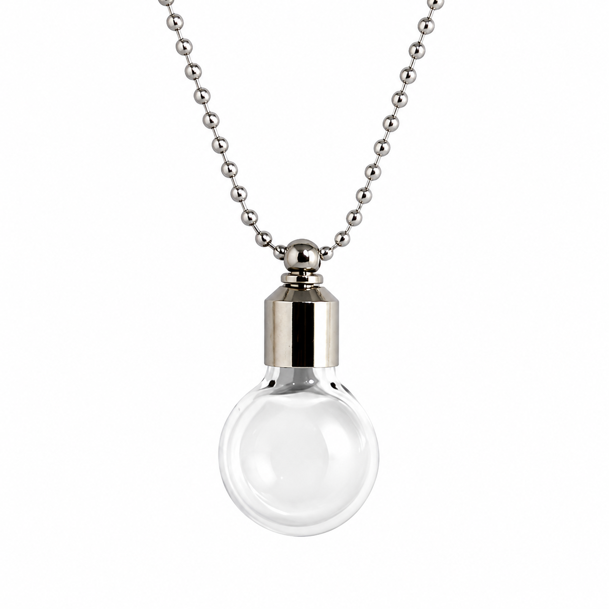 Clear round glass orb vial pendant with a silver cap on a silver ball chain, shown against a white background.