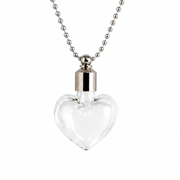 Clear glass heart-shaped vial pendant with a silver cap on a silver ball chain, shown against a white background.